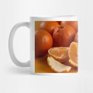 Oranges on a yellow background Mug